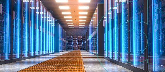 Interior view of a modern data center with rows of server racks.